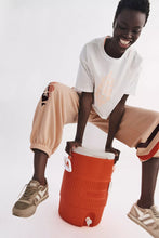 Load image into Gallery viewer, Free People Inspire Buti Logo Tee/White Pastel Peach Combo